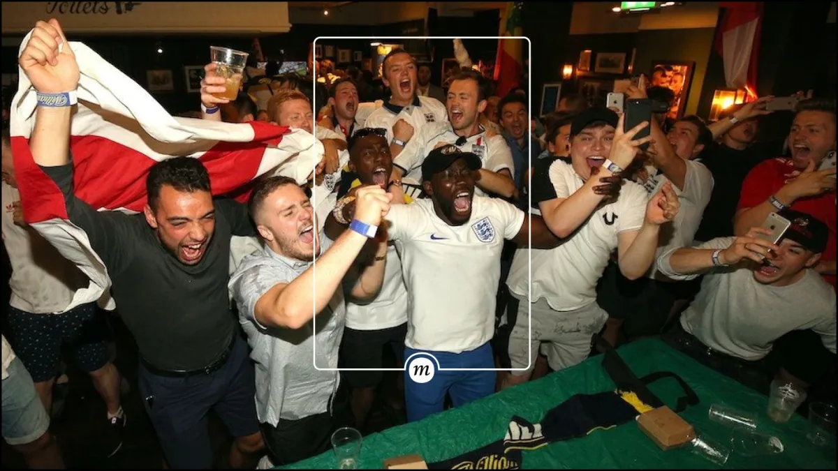 The frame over fans celebrating in a pub